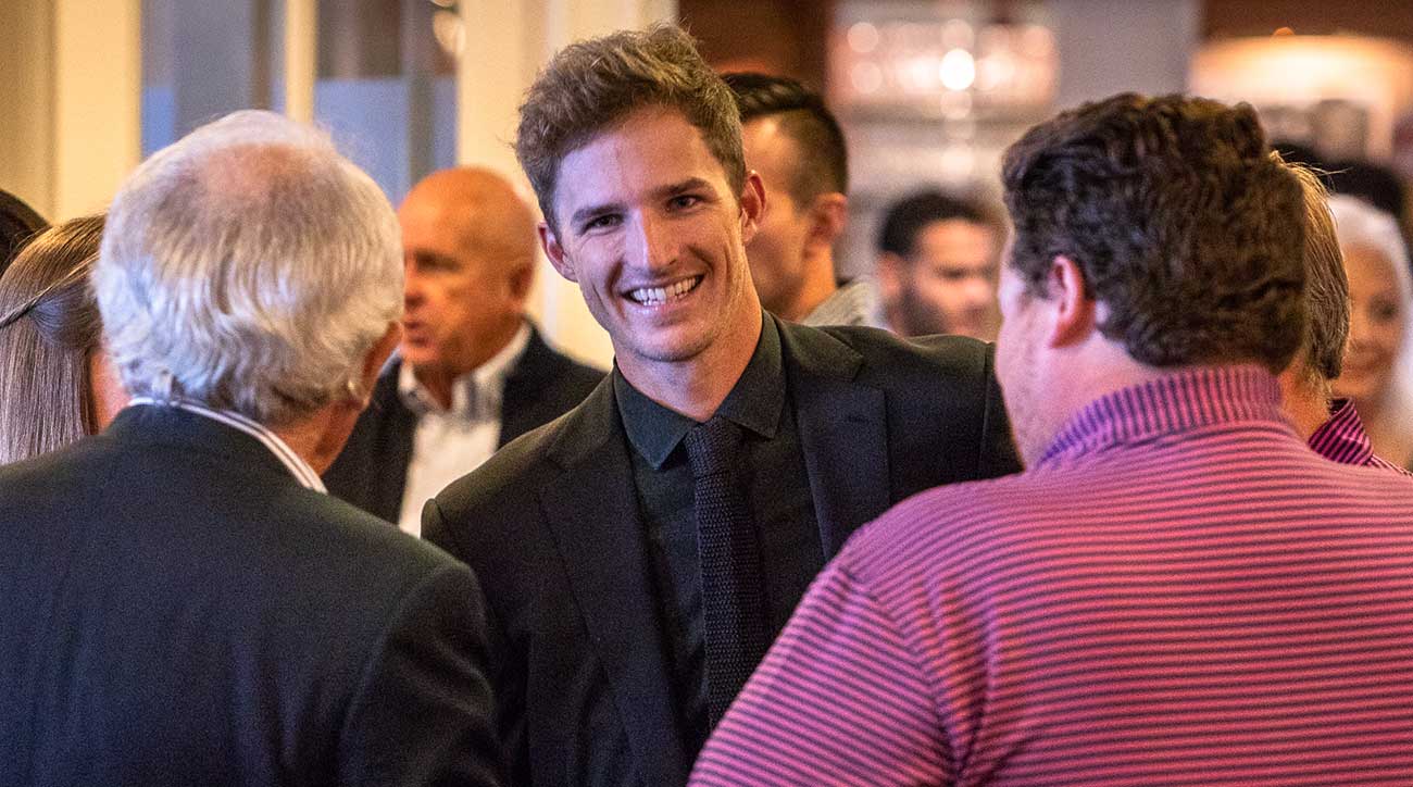 Morgan Hoffmann talks to guests at his event to raise awareness about muscular dystrophy