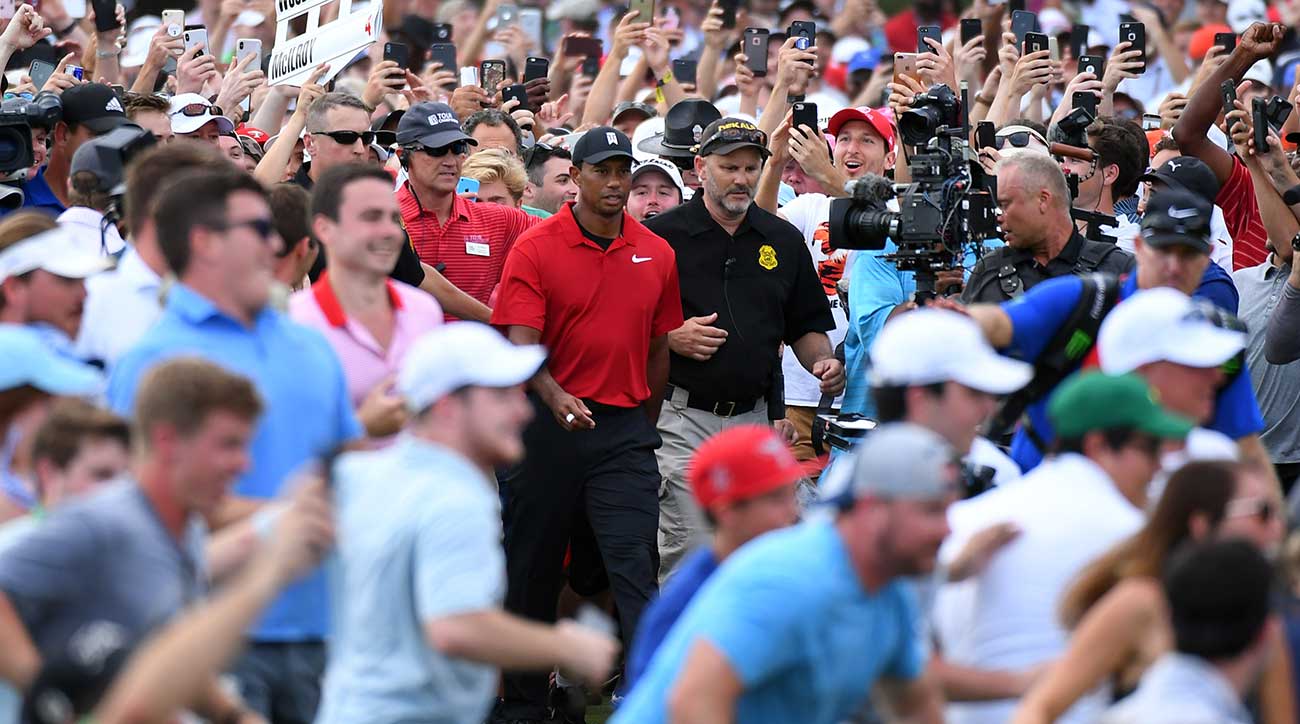 Woods had the crowd behind him, literally, on the 18th hole.