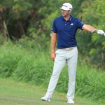 Dustin Johnson (left) and Justin Thomas discuss DJ's situation on the 4th hole Friday at the Tournament of Champions.