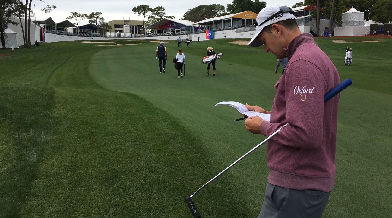 Martin Trainer consults his yardage book