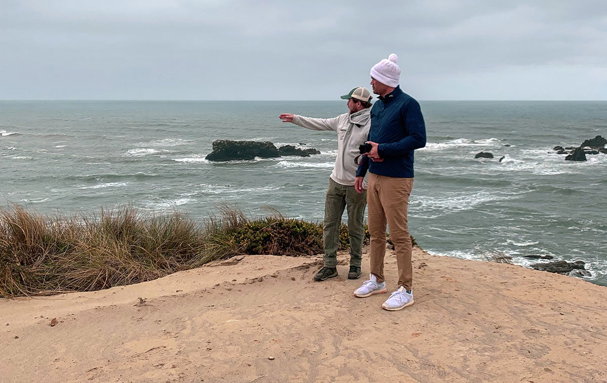 Back on the 17th tee box, looking south and pointing to the Pacific Ocean. 