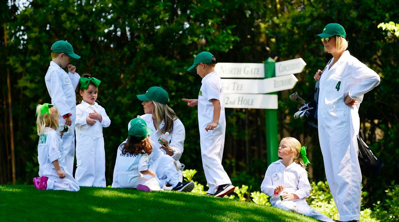 Jason Day's wife, Ellie, and Bubba Watson's wife, Angie, with their families.