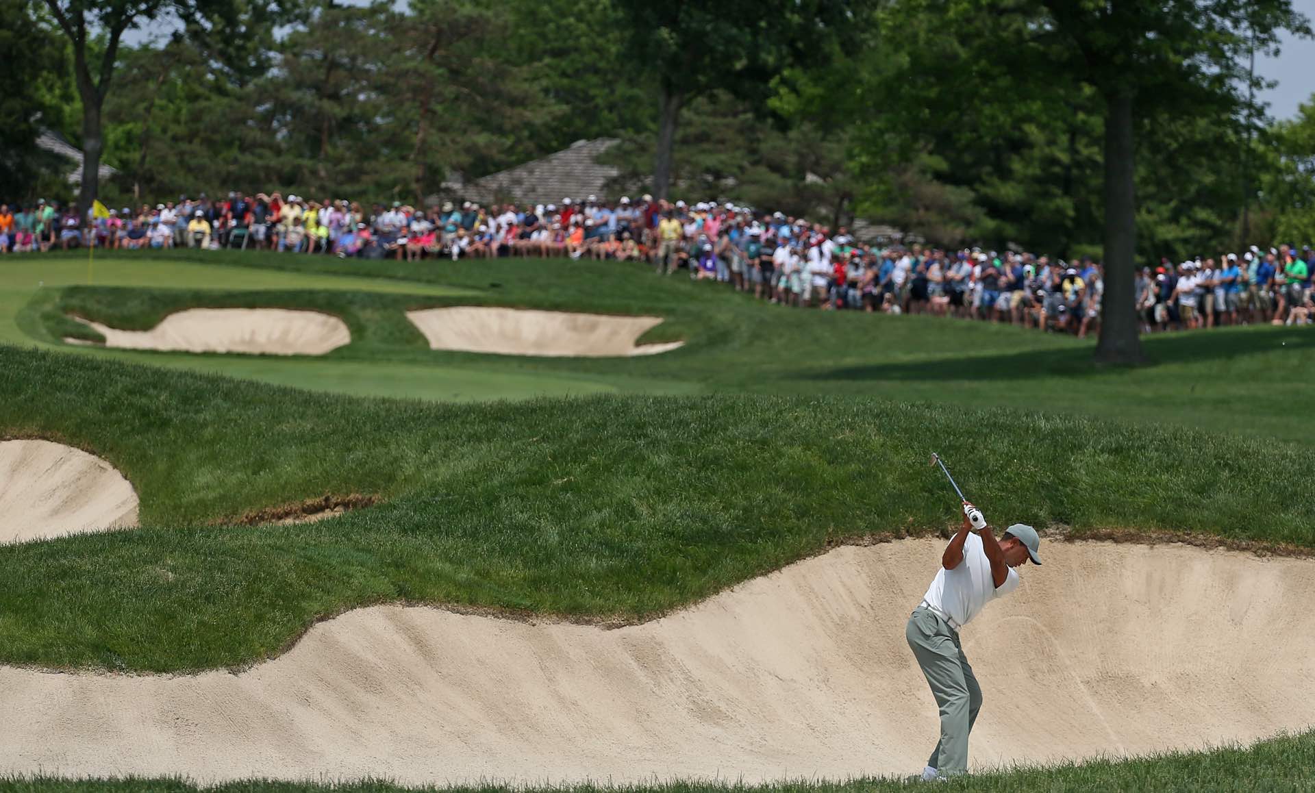 Woods's hot round came undone in the sand trap on the 10th hole.