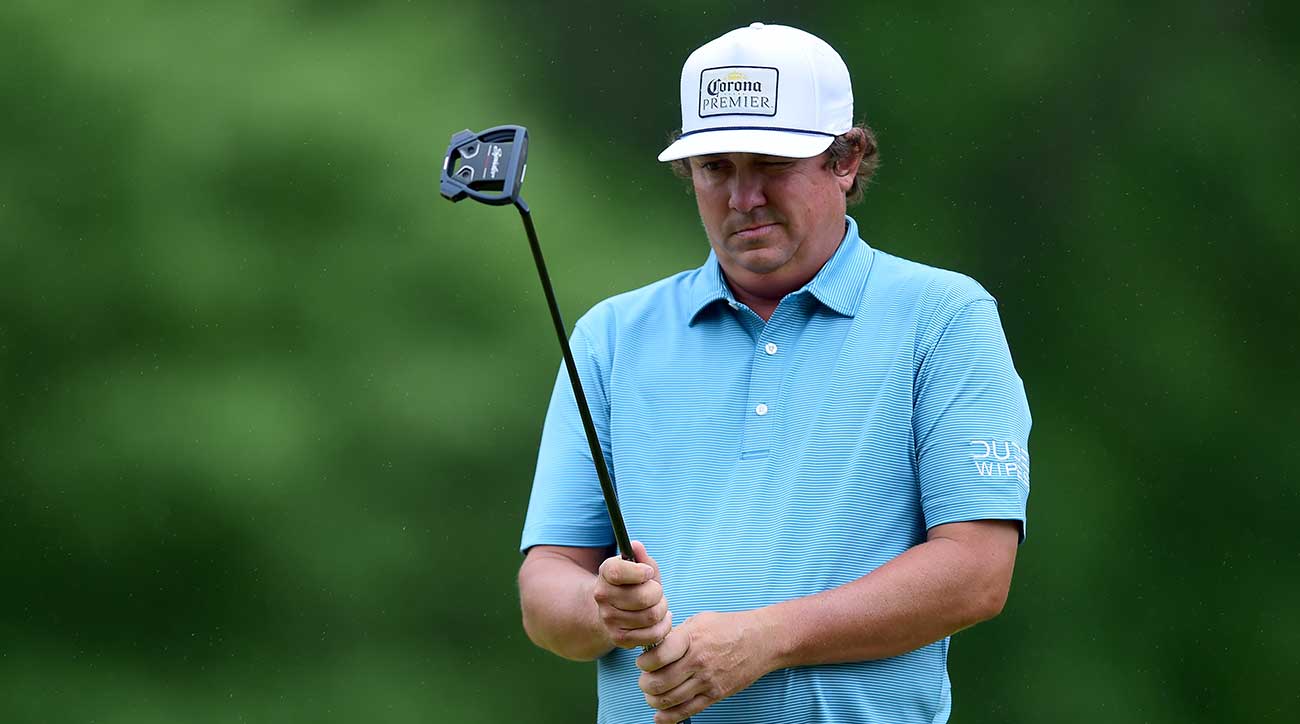 Jason Dufner lines up a putt.