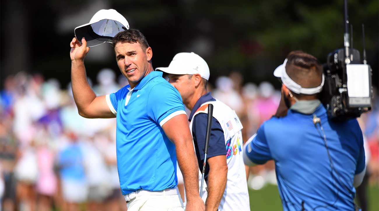 Brooks Koepka waves to the crowd after winning the WGC-FedEx St. Jude on Sunday.