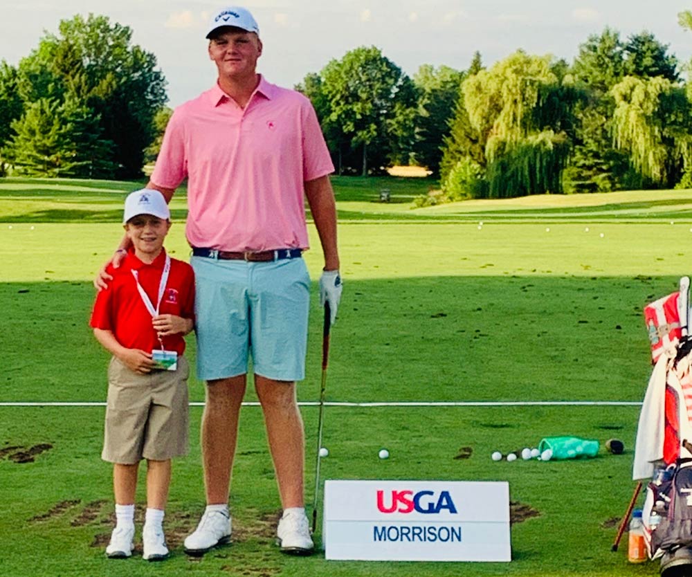 Tommy Morrison with a young aspiring golfer.