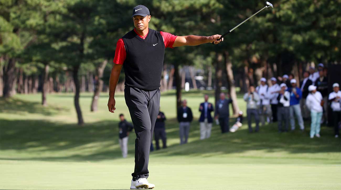Tiger Woods raises his putter after winning the Zozo Championship on Monday in Japan.