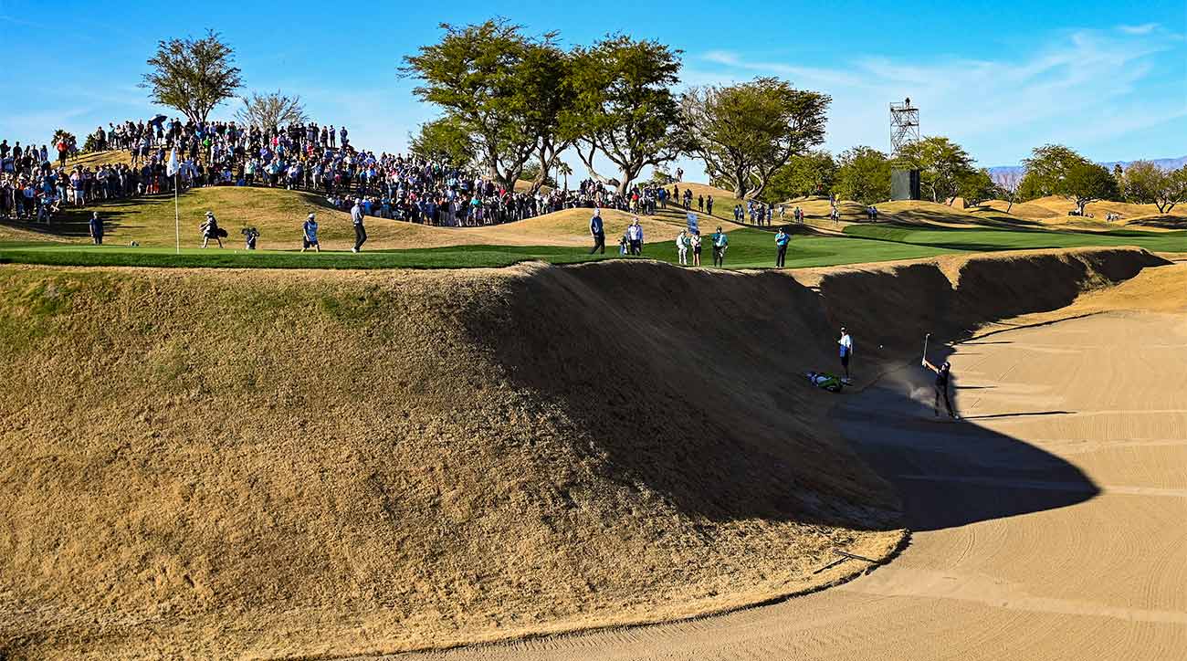 Phil Mickelson blasts out of the massive bunker left of the green on the 16th hole of PGA West's Stadium Course.