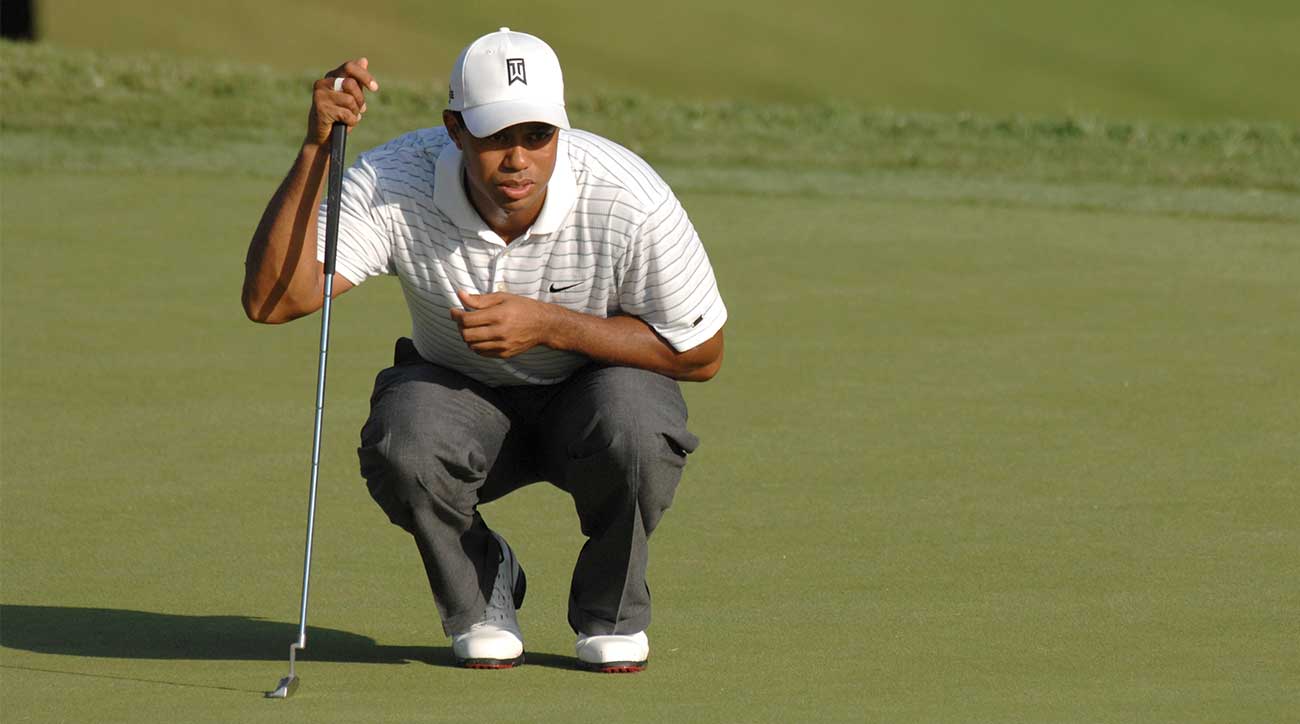 Tiger Woods reads a putt.