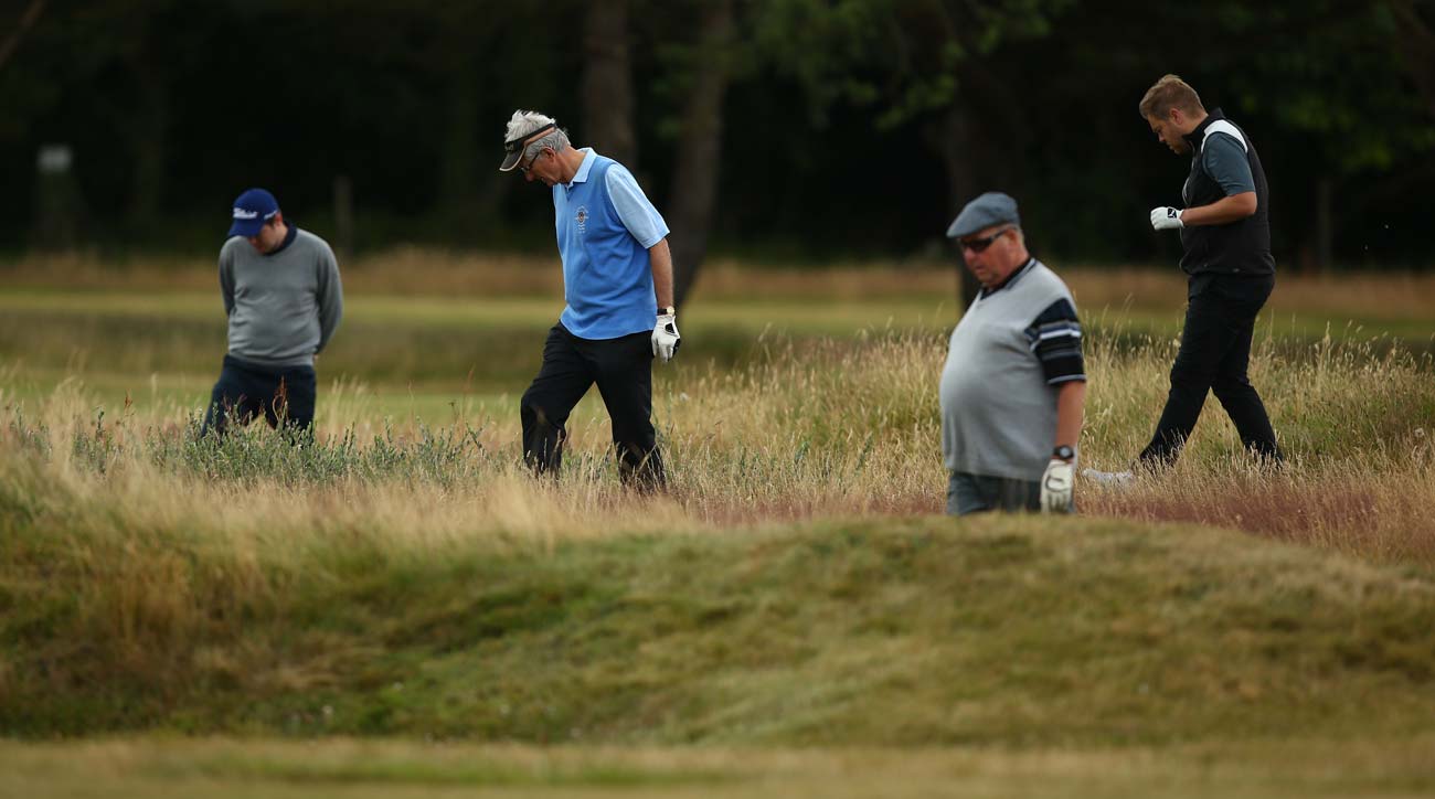 people searching for a lost ball