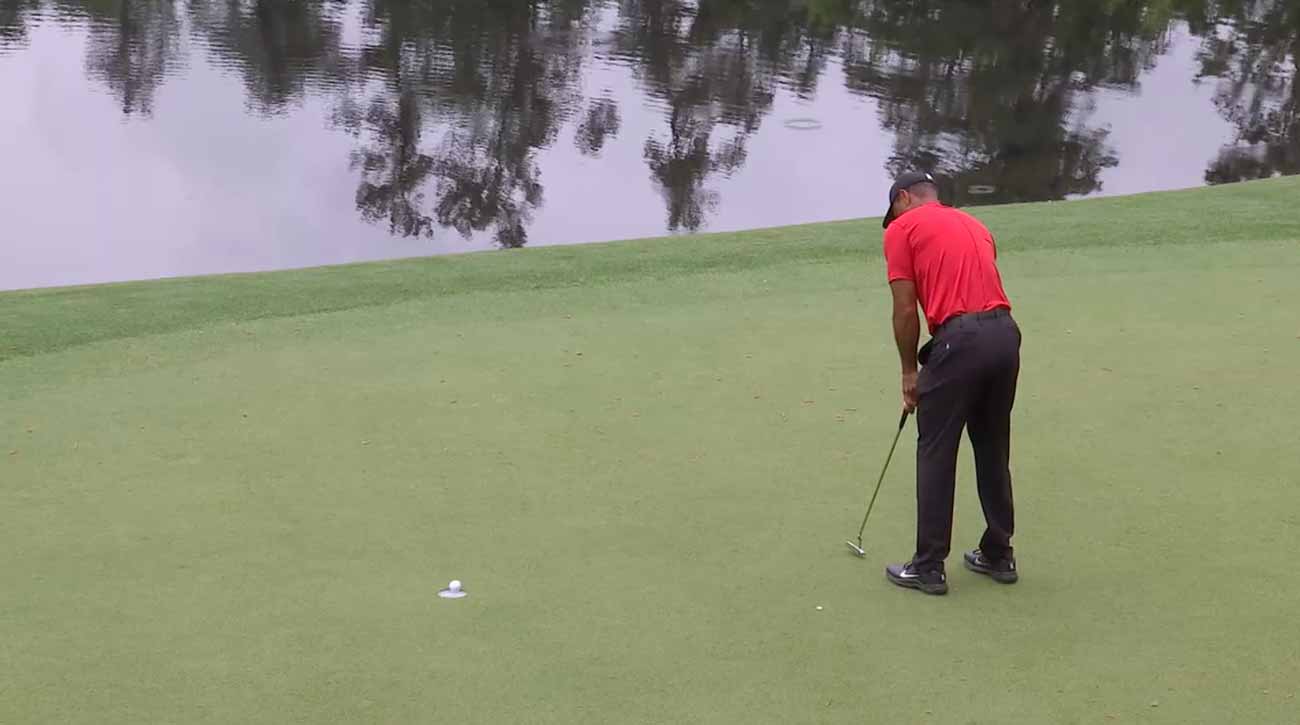 That putt on No. 12 stayed up — barely — and Woods was suddenly tied for the lead.