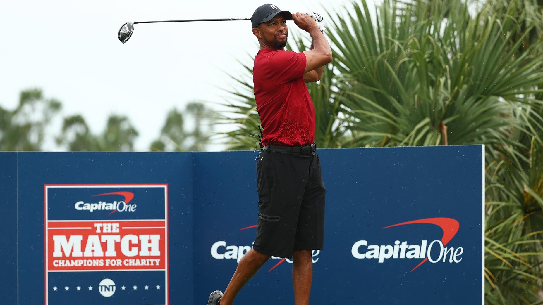 tiger woods hits shot at the match