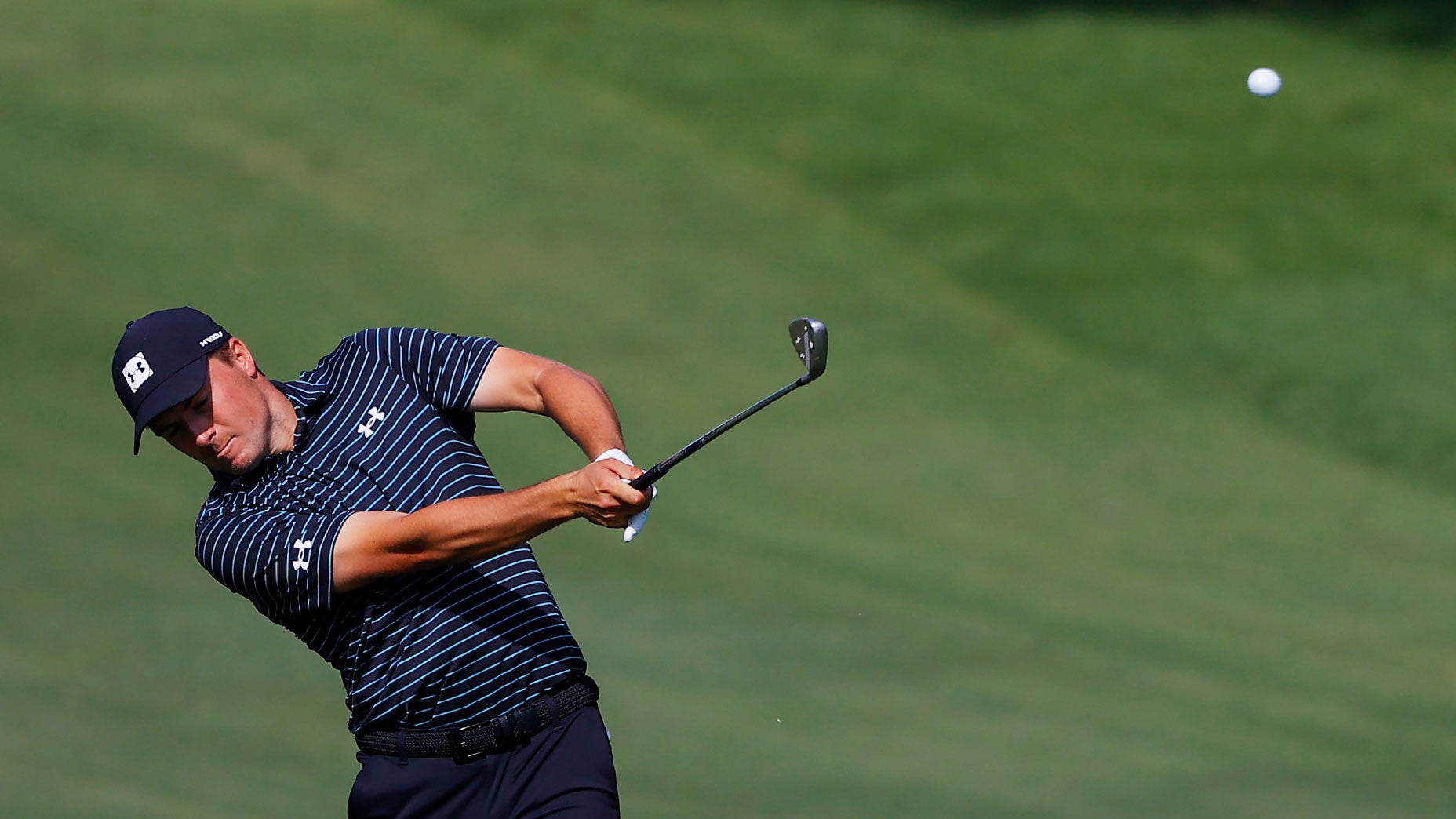 Jordan Spieth hits a shot on the 18th hole at Colonial Country Club.