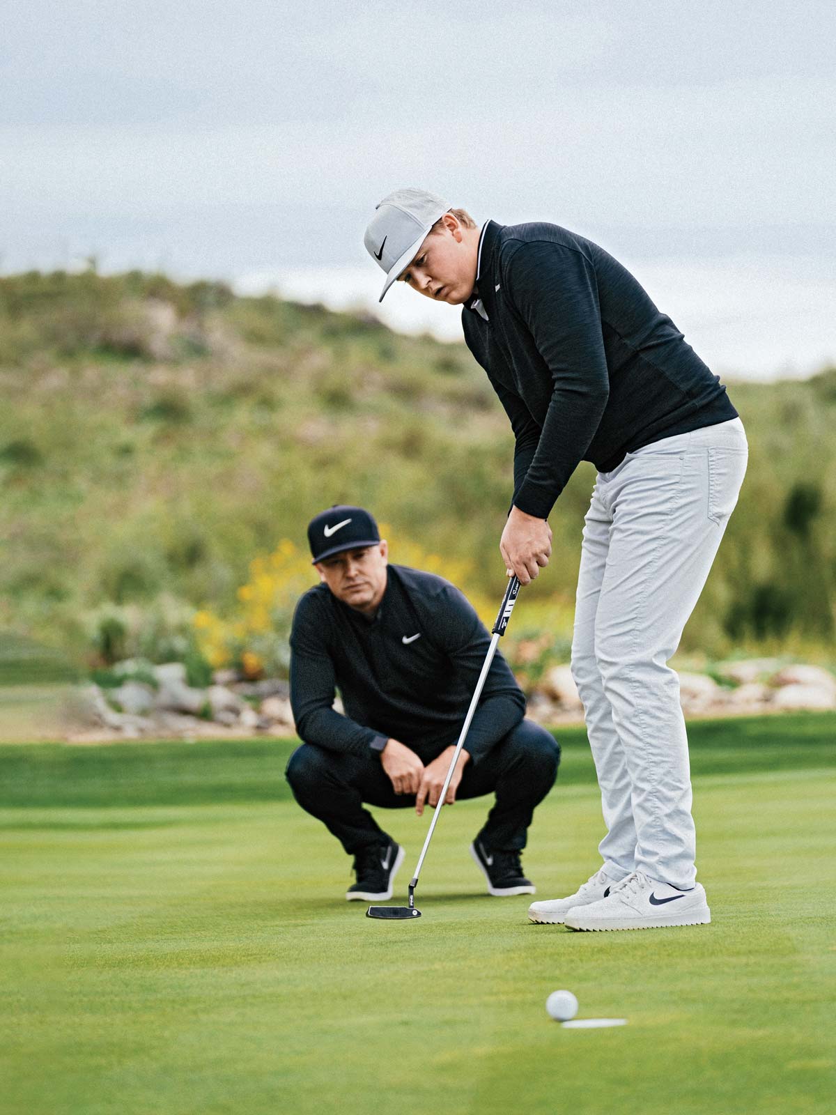 preston summerhays putts as his father looks on