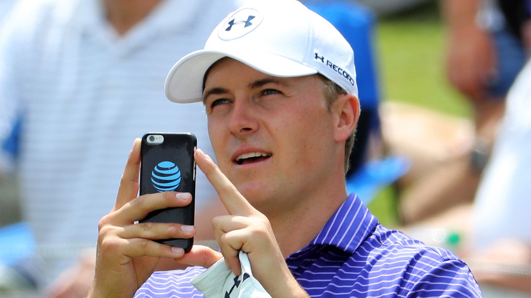 Jordan Spieth takes a photo