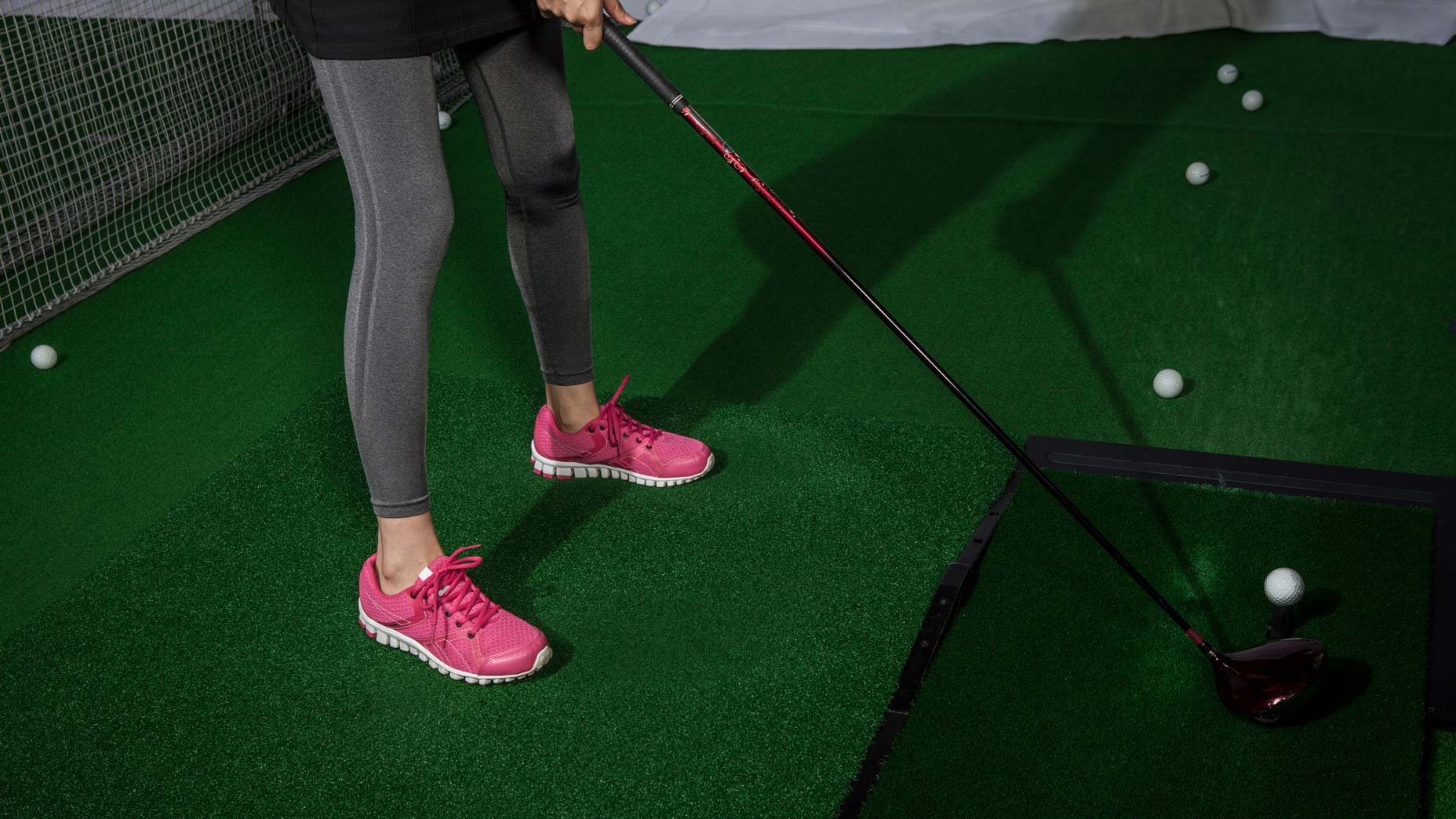 woman in golf simulator