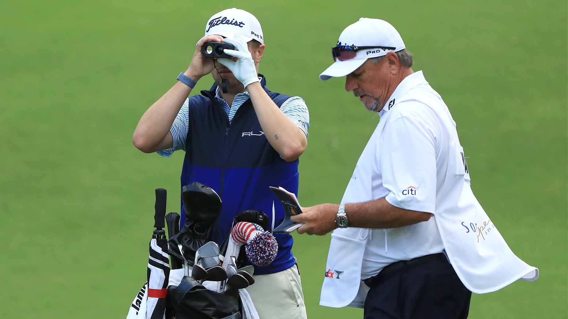 Justin Thomas uses a range finder.