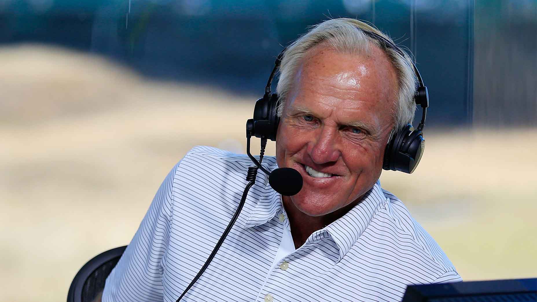 greg norman smiles at camera