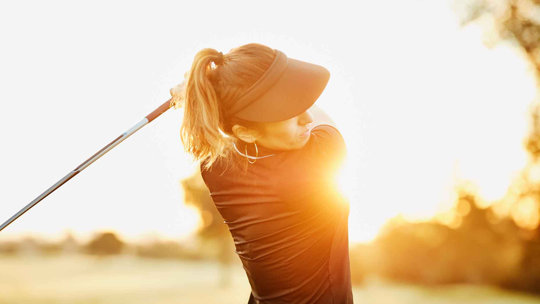 Woman golfer backswing