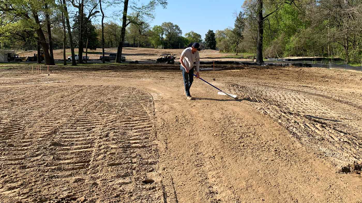 Raking the sand at overton park