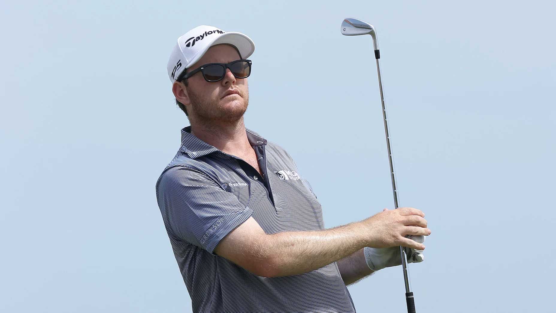 PGA Tour pro Harry Higgs watches shot.