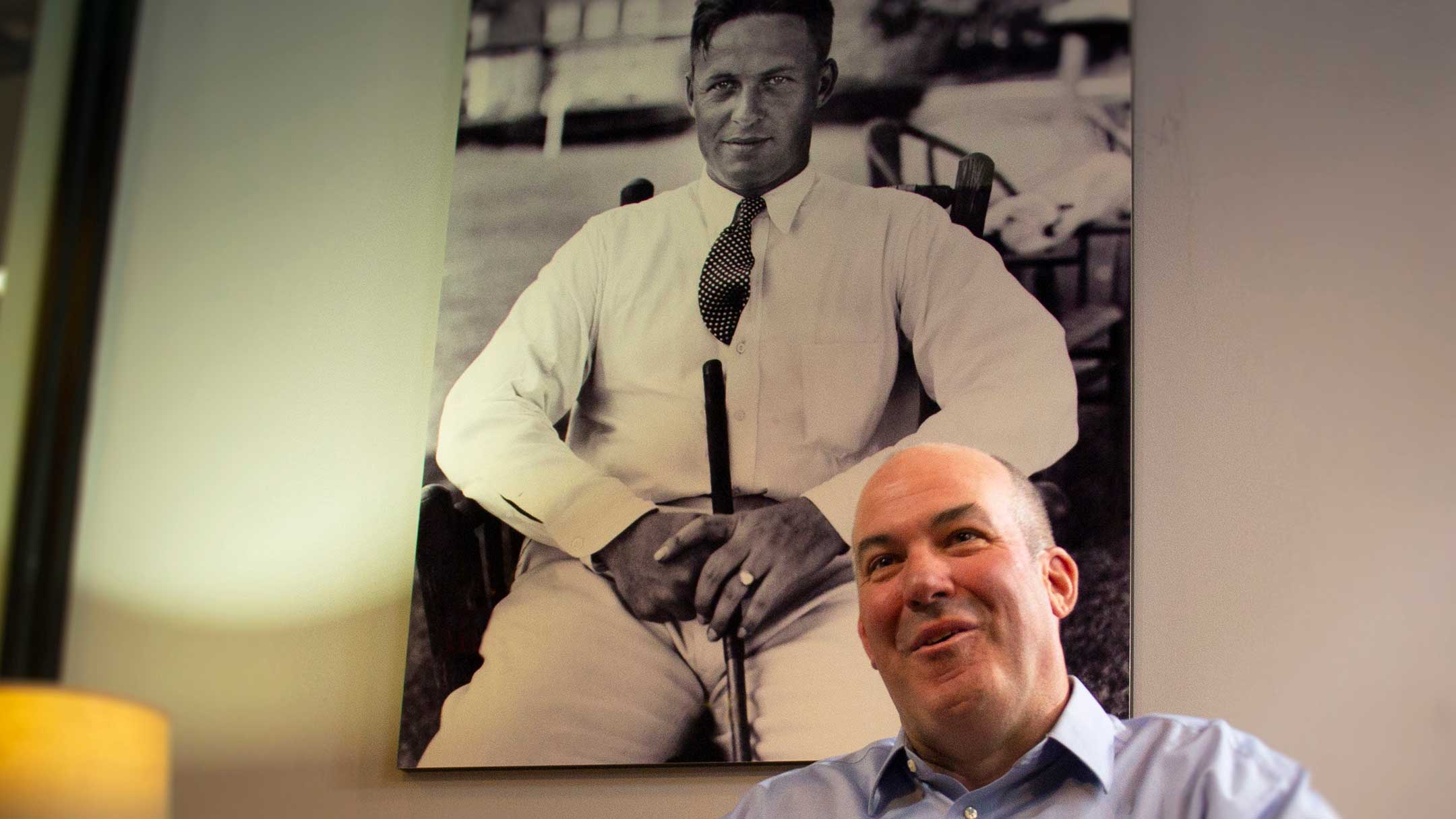 robert black jones bneath a portrait of bobby jones