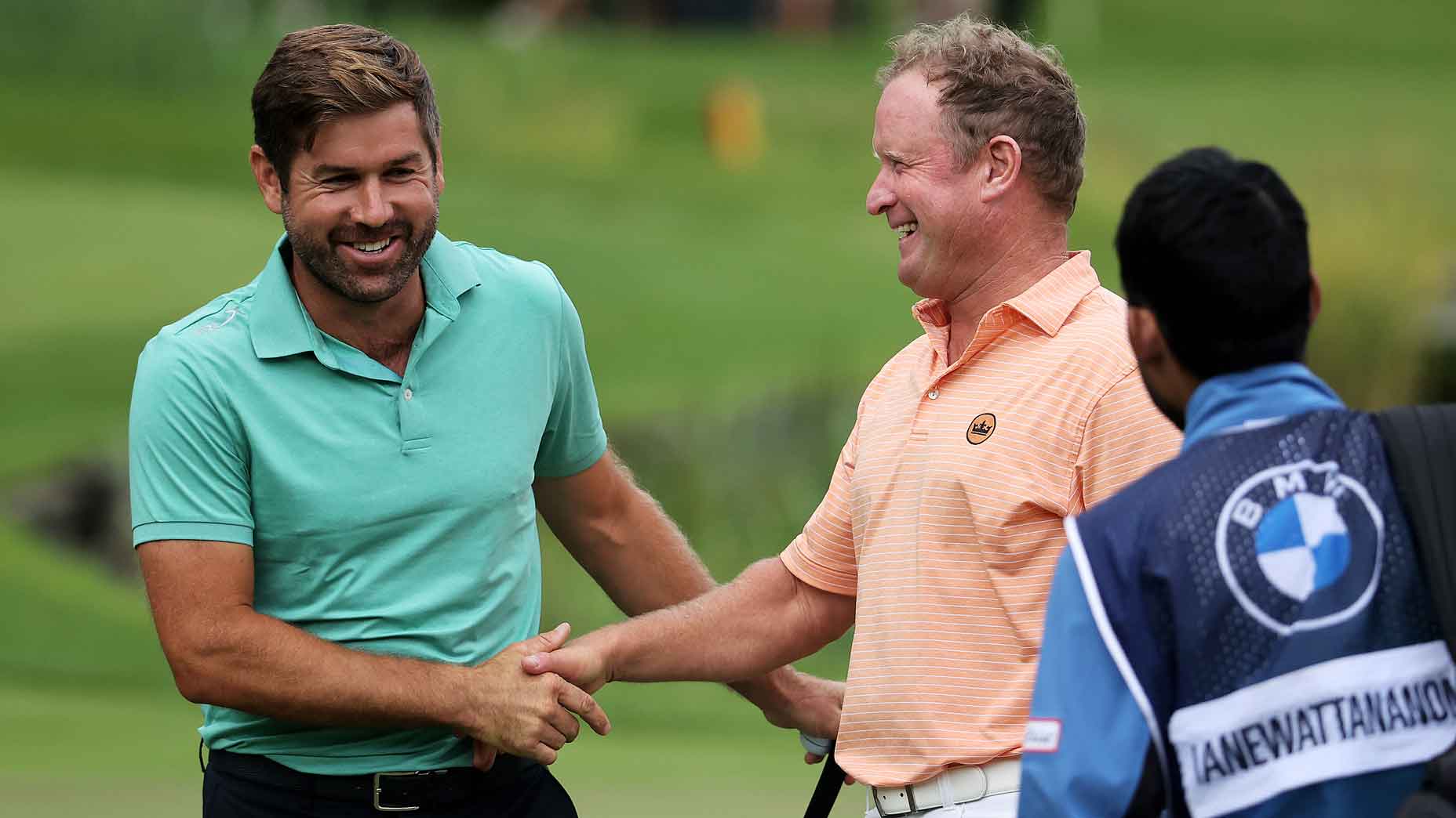 Robert Rock shakes hands with Jamie Donaldson