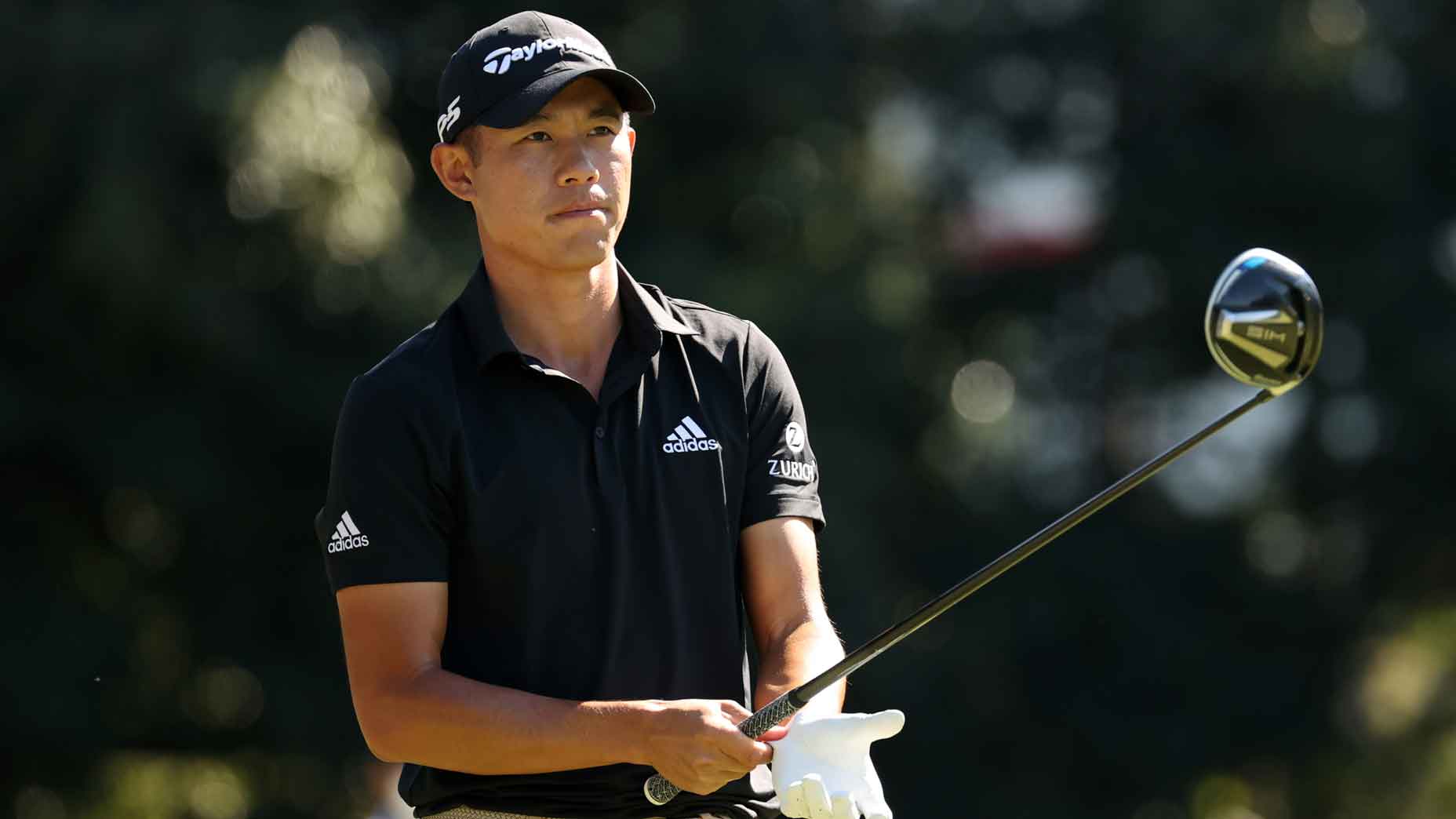 Collin Morikawa prepares to hit a shot