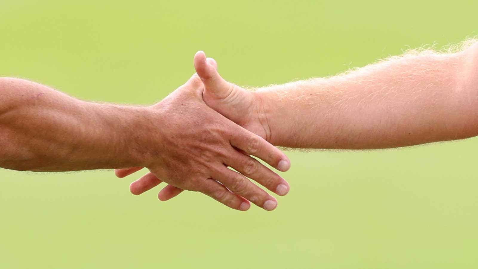 golfers shaking hands