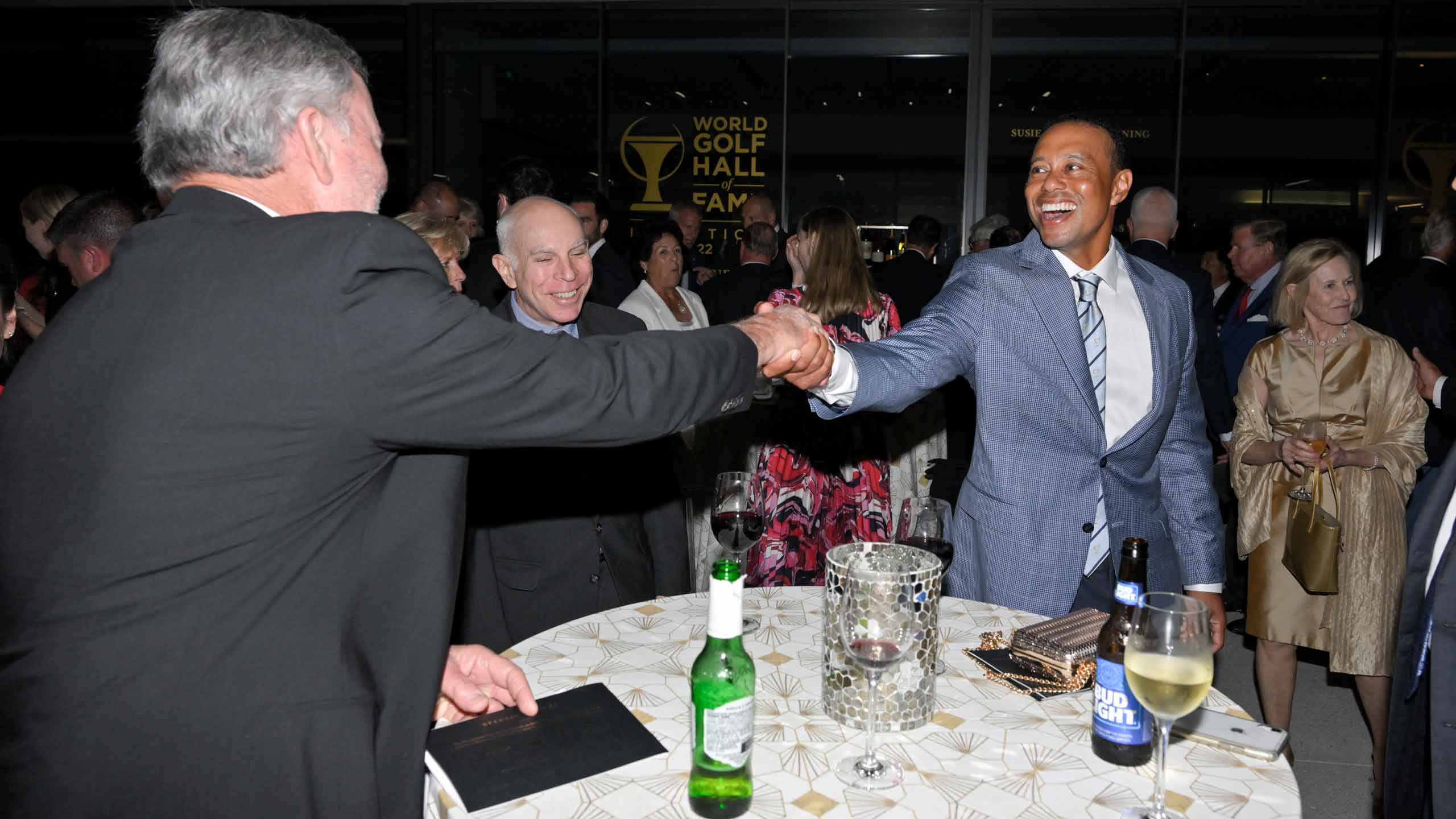 tiger woods fist bumps a man