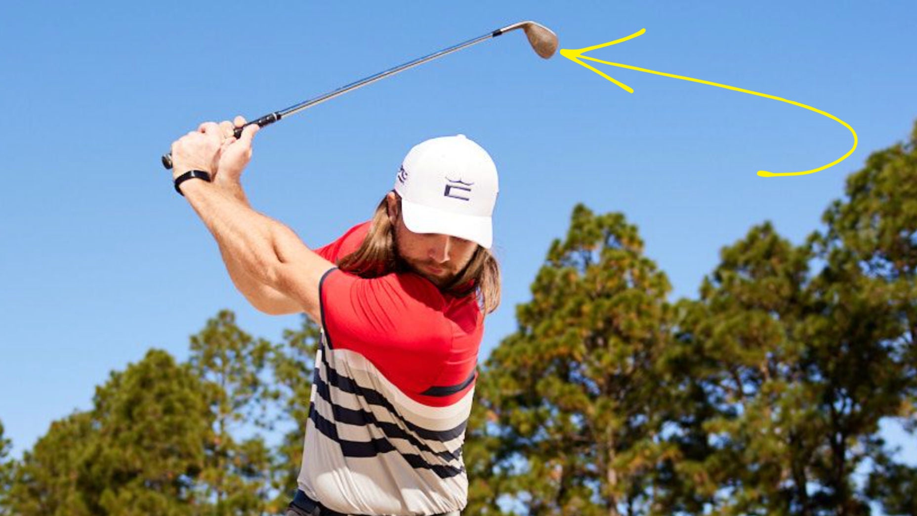 Kyle Berkshire makes a golf shot