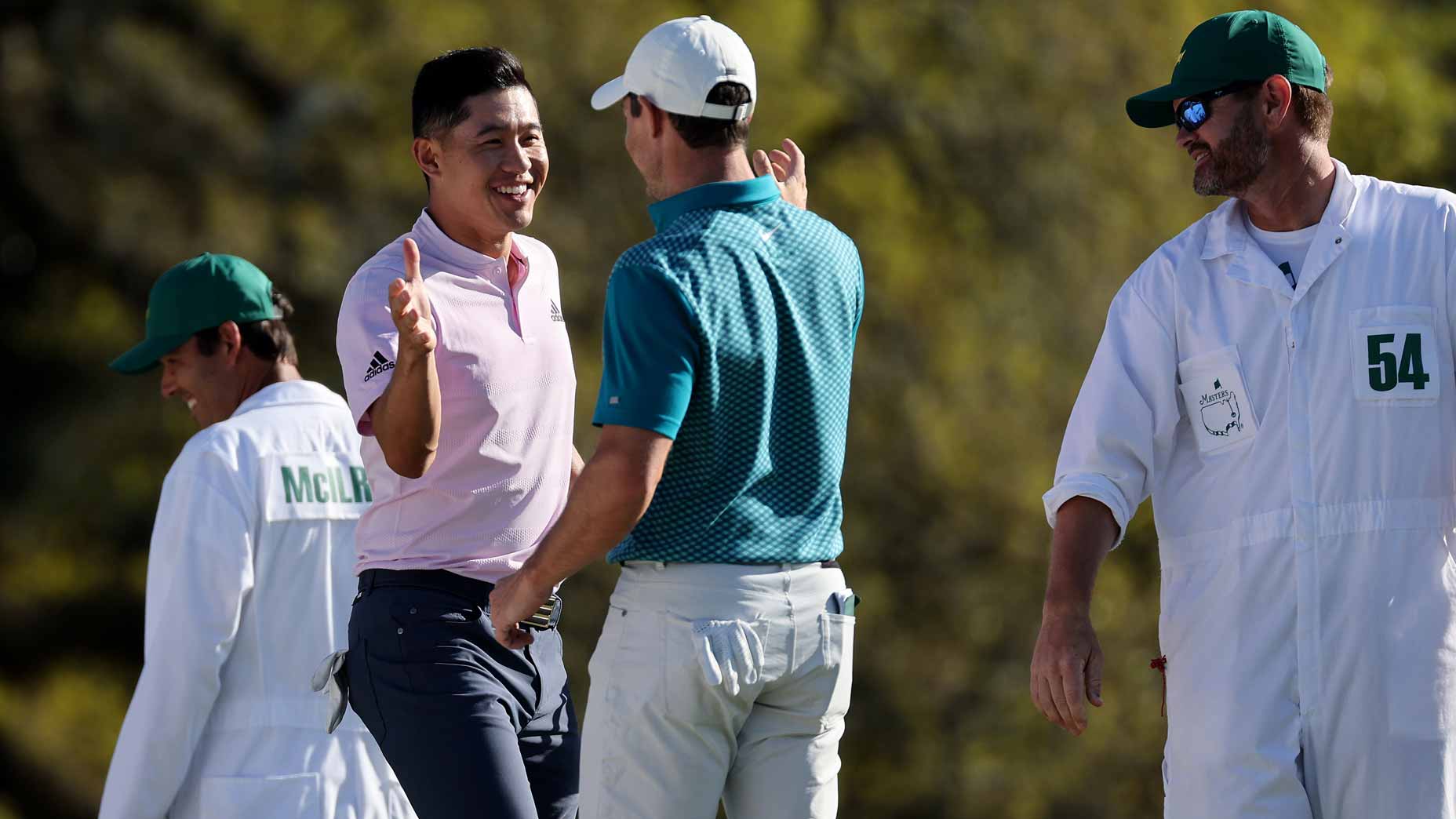 rory mcilroy high fives collin morikawa at masters