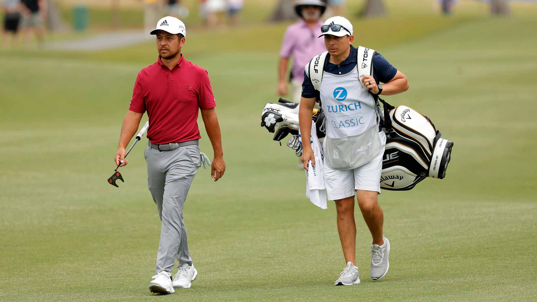 Xander Schauffele walks with caddie during 2022 Zurich Classic