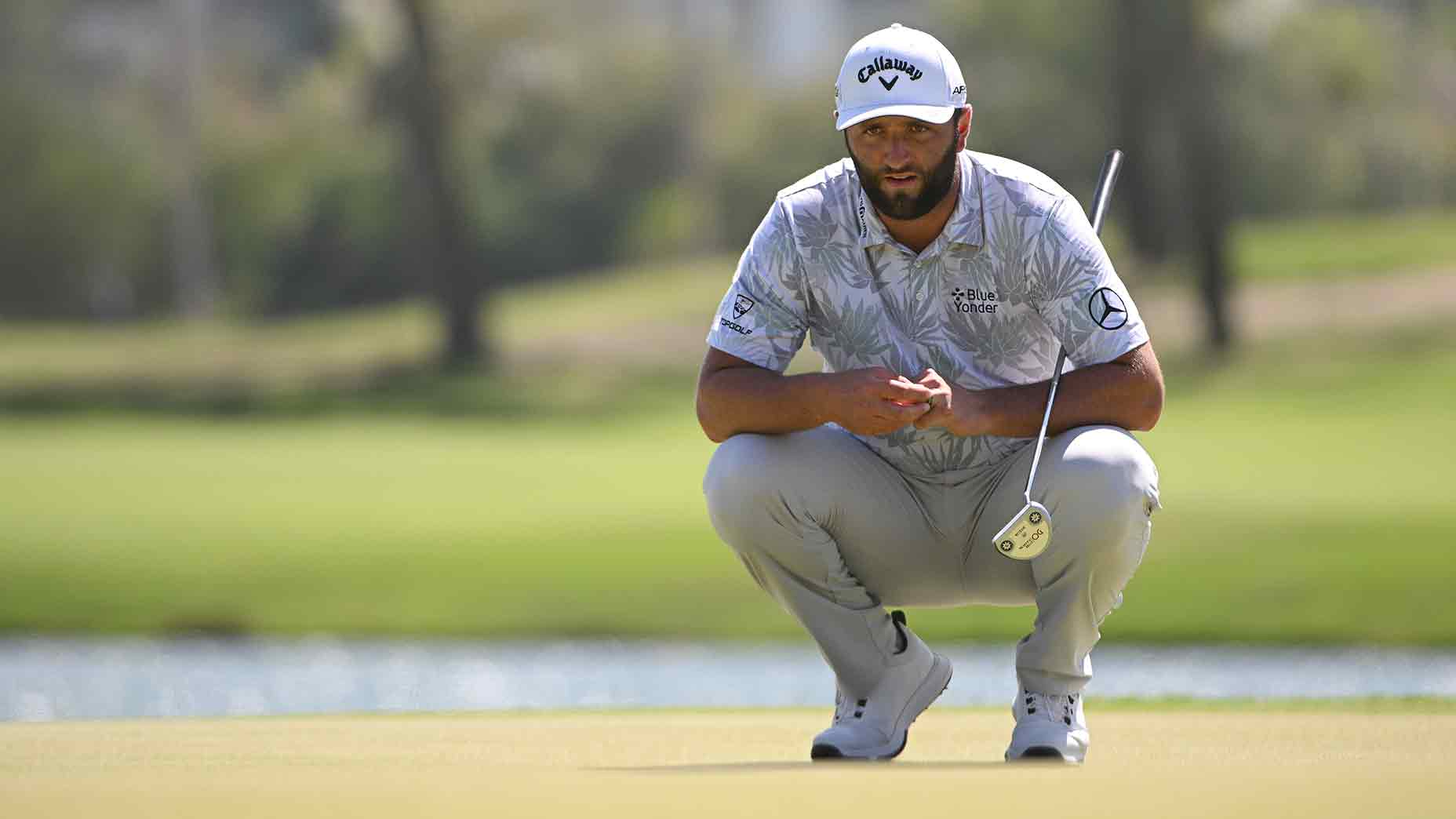 jon rahm crouches mexico open