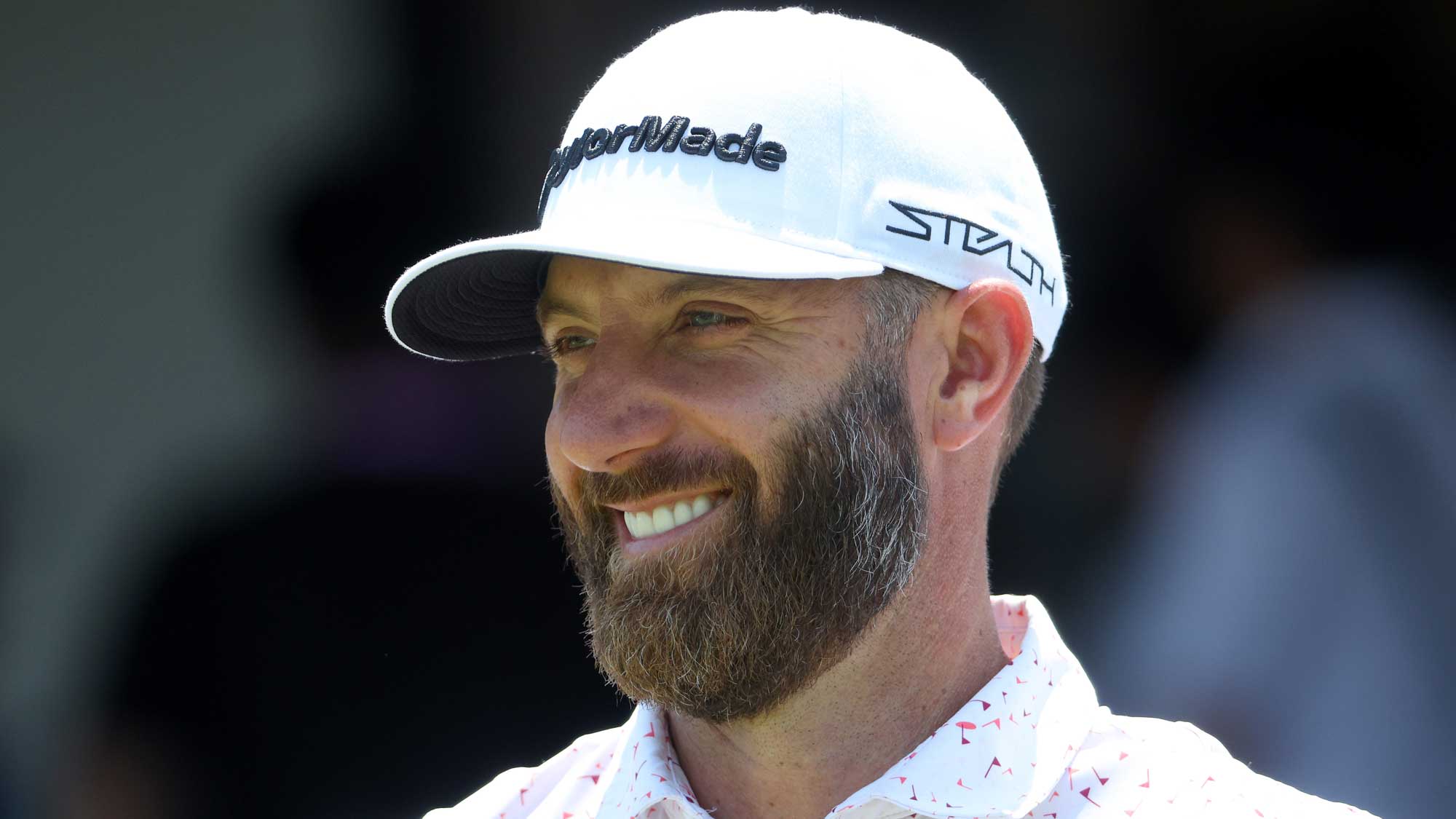 Dustin Johnson of the United States smiles on the first tee during a practice round prior to the start of the 2022 PGA Championship at Southern Hills Country Club on May 18, 2022 in Tulsa, Oklahoma.