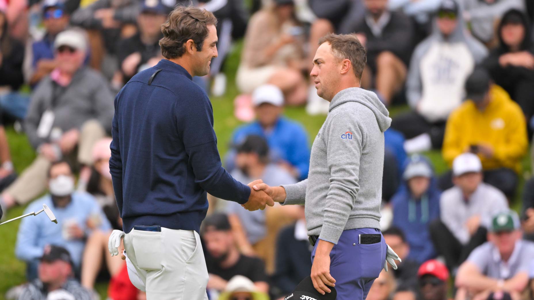 Scottie Scheffler and Justin Thomas shake hands on green at 2022 Genesis Invitational