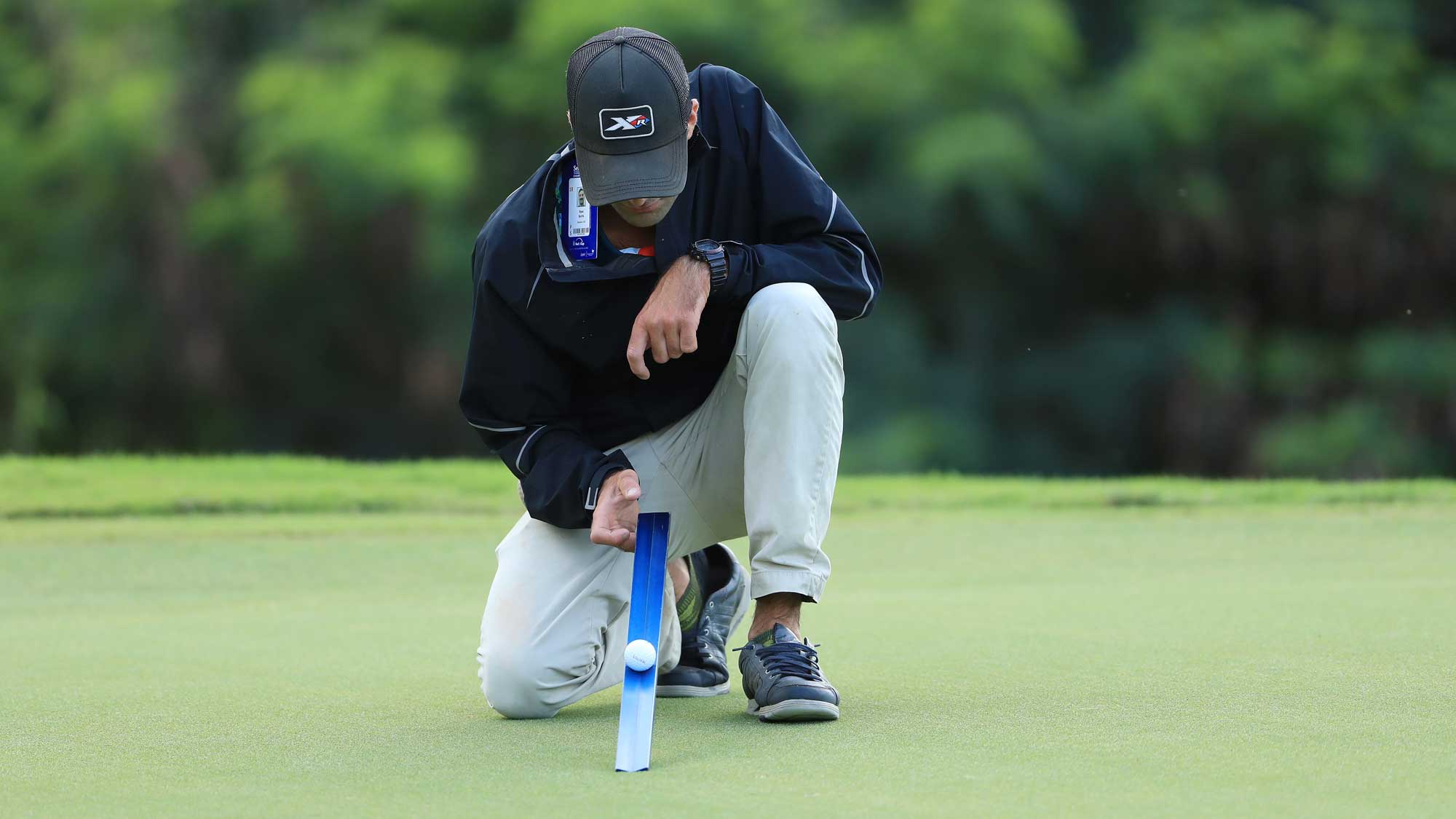 superintendent with a stimpmeter