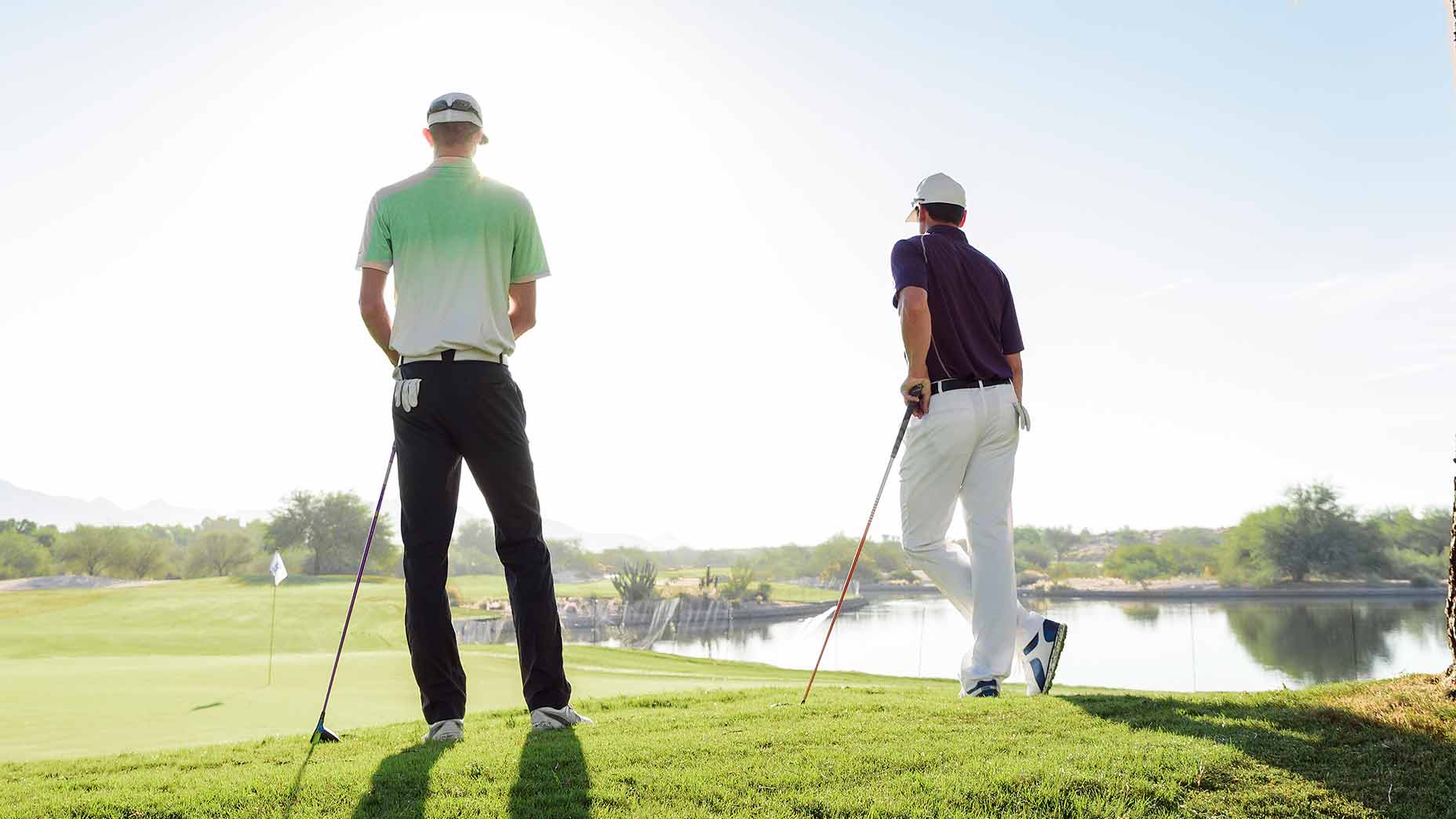 two friends playing golf