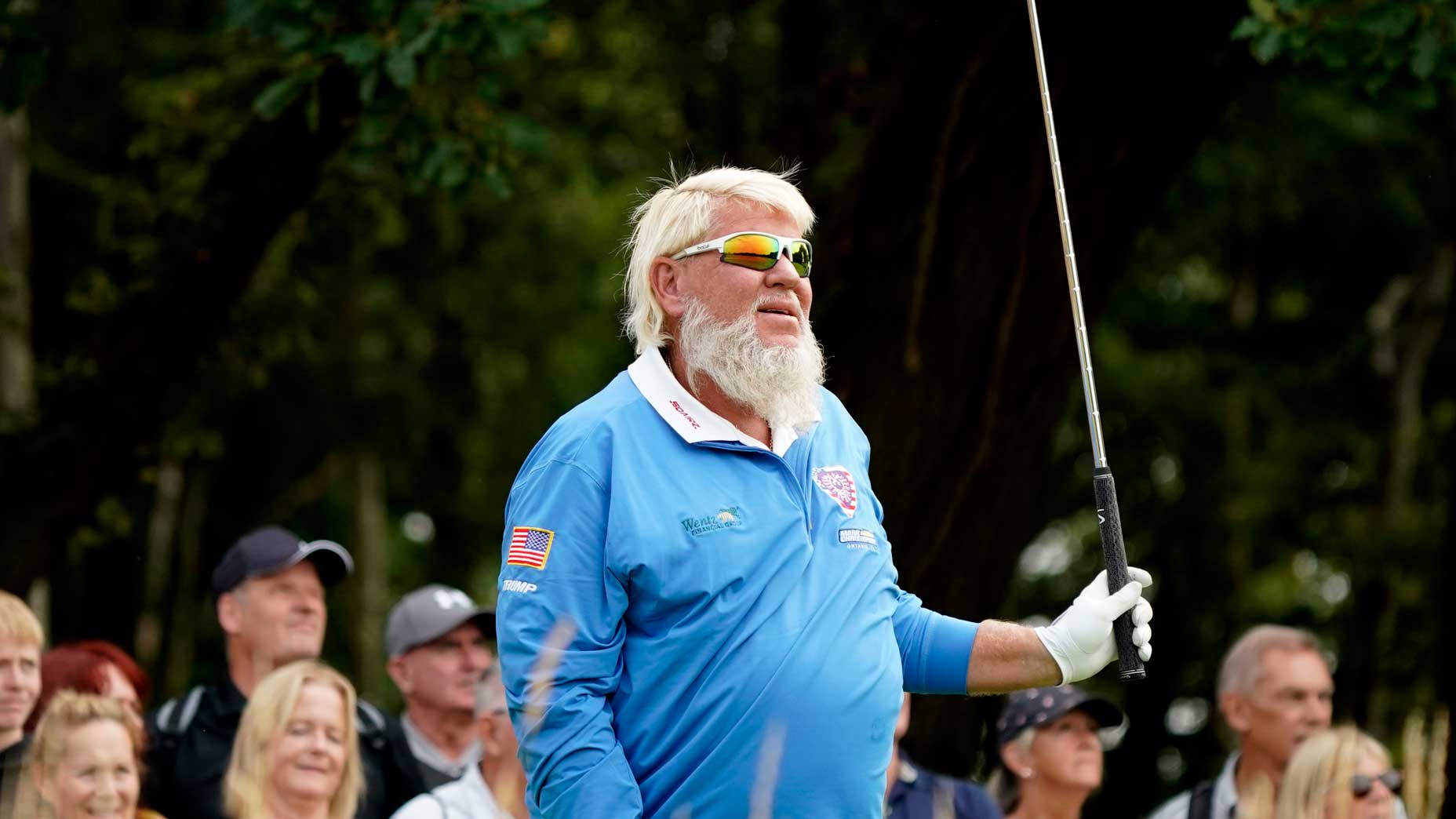 John Daly reacts to a tee shot