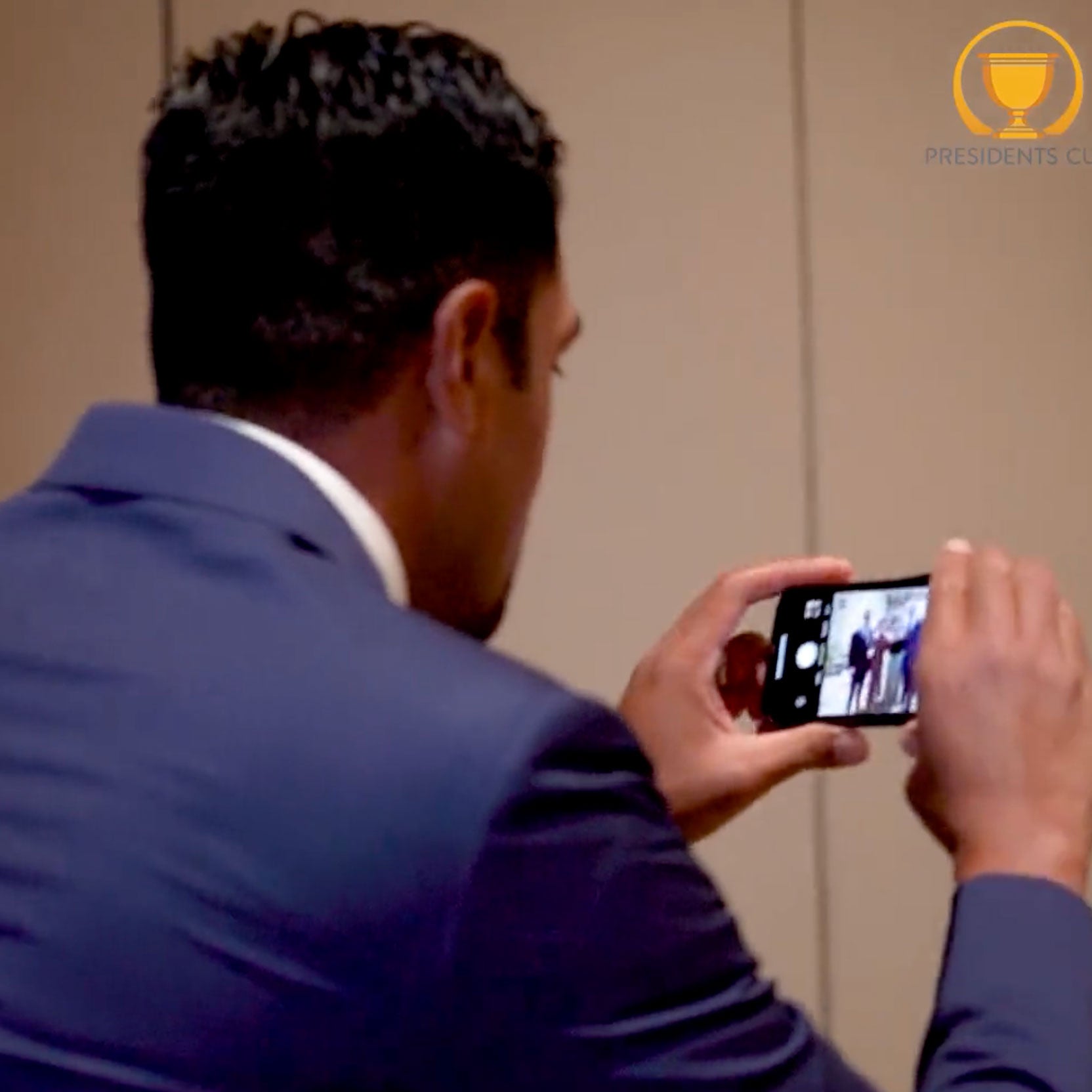 Tony Finau serving as a cameraman