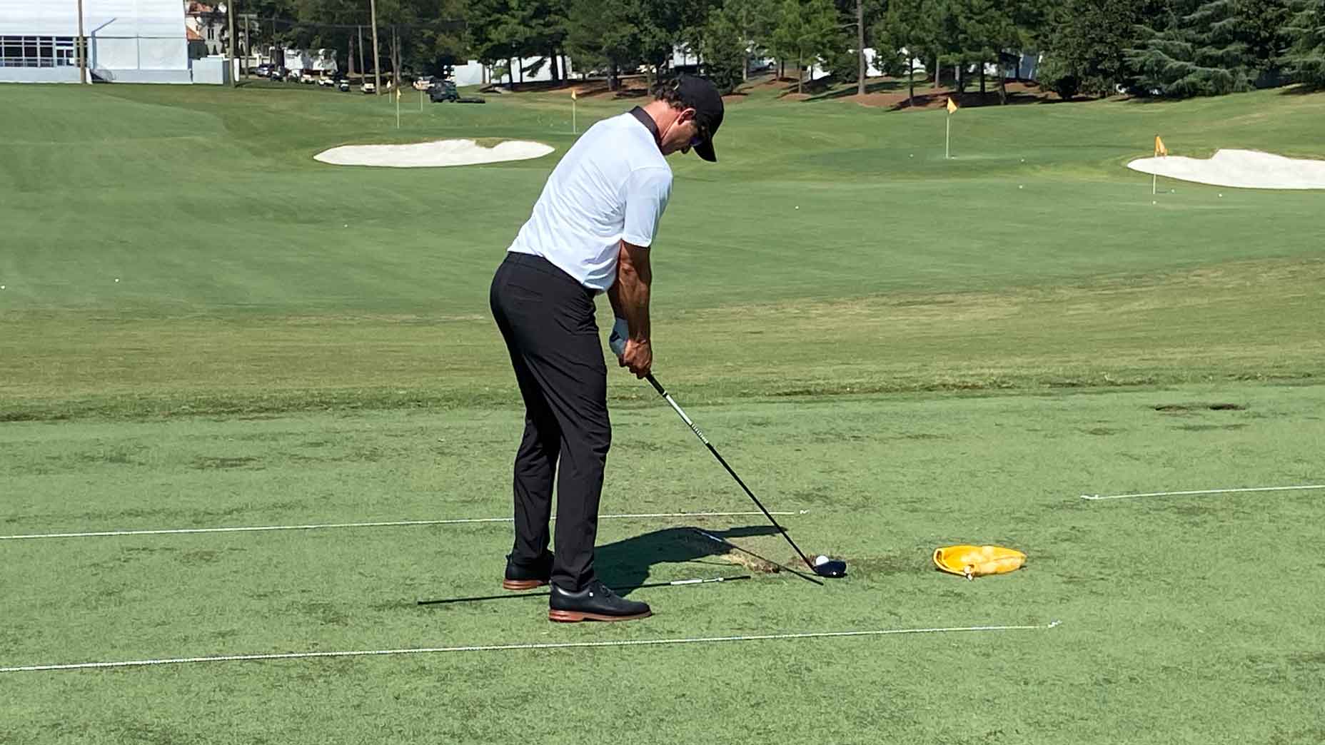 adam scott hits balls on the range