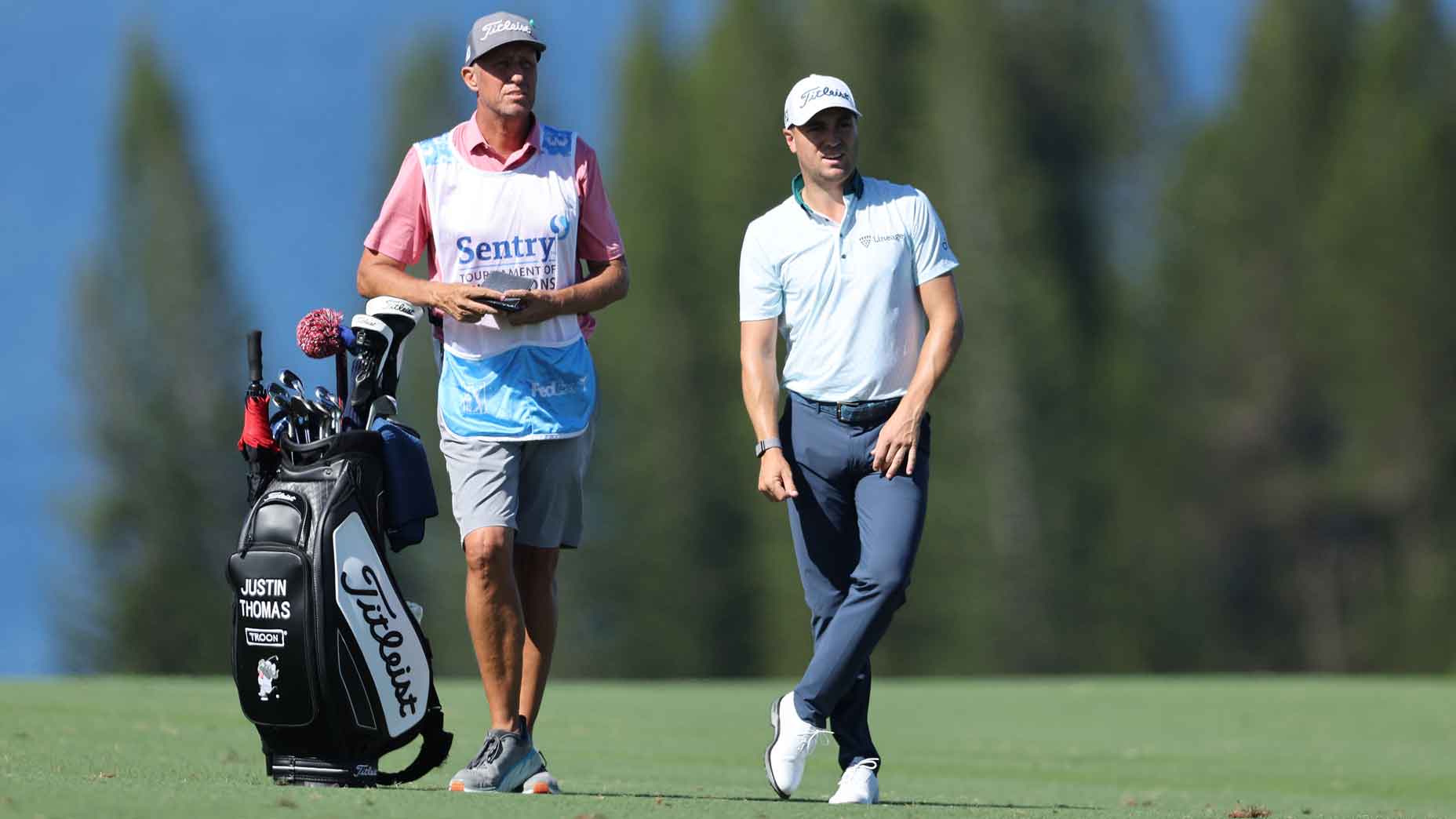 bones mackay stands next to justin thomas