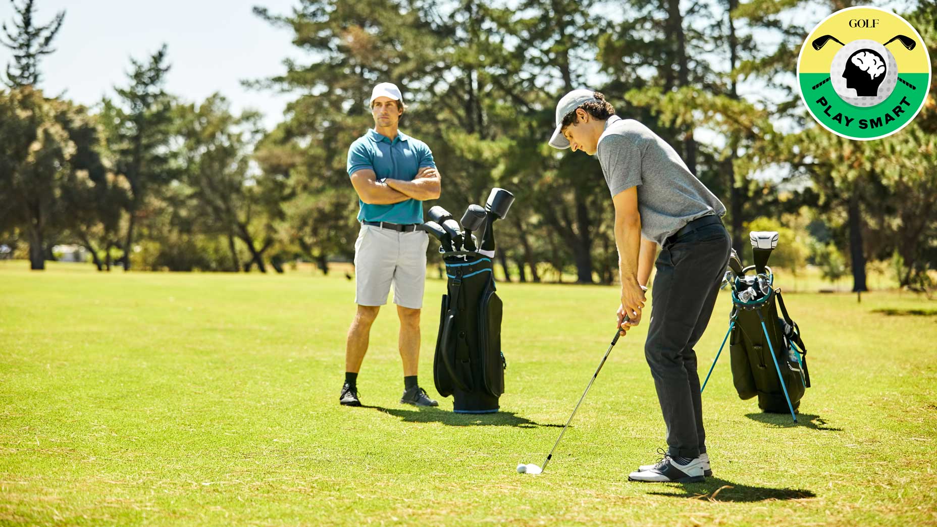 golfer watches other golfer hit