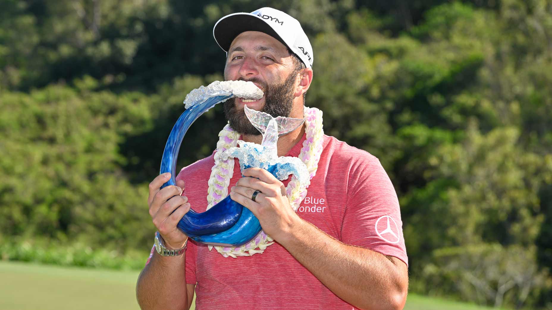 Jon Rahm bites into trophy at 2023 Tournament of Champions
