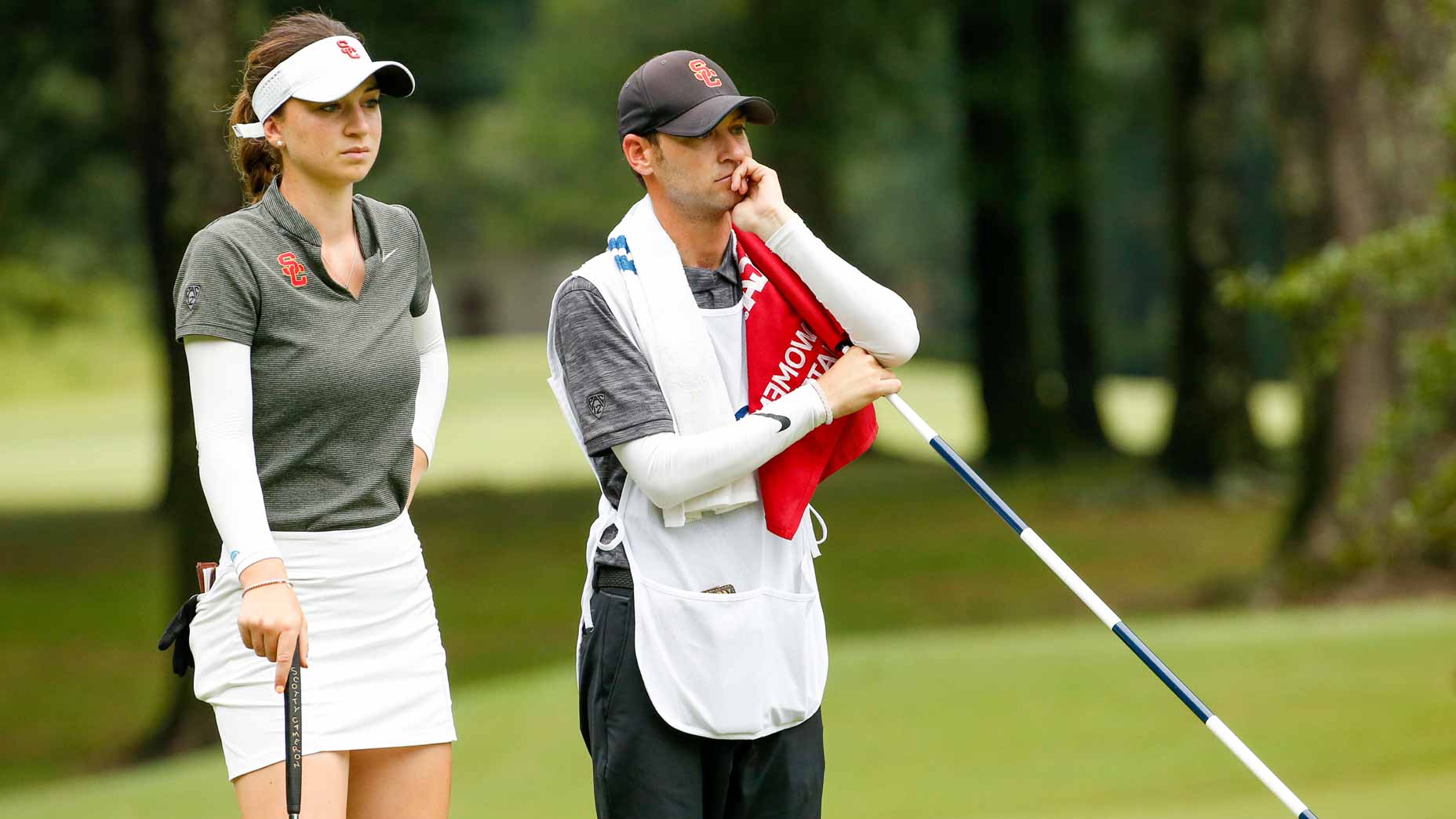 Gabriela Ruffels watches her semifinal opponent, Andrea Lee, with her caddie/USC golf coach, Justin Silverstein, on the seventh green.