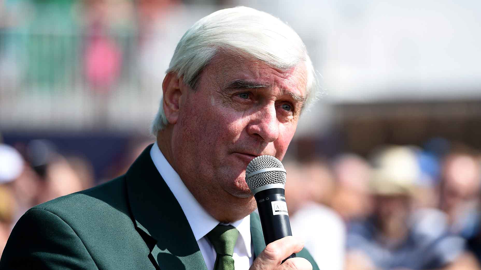 ivor robson holds mic open