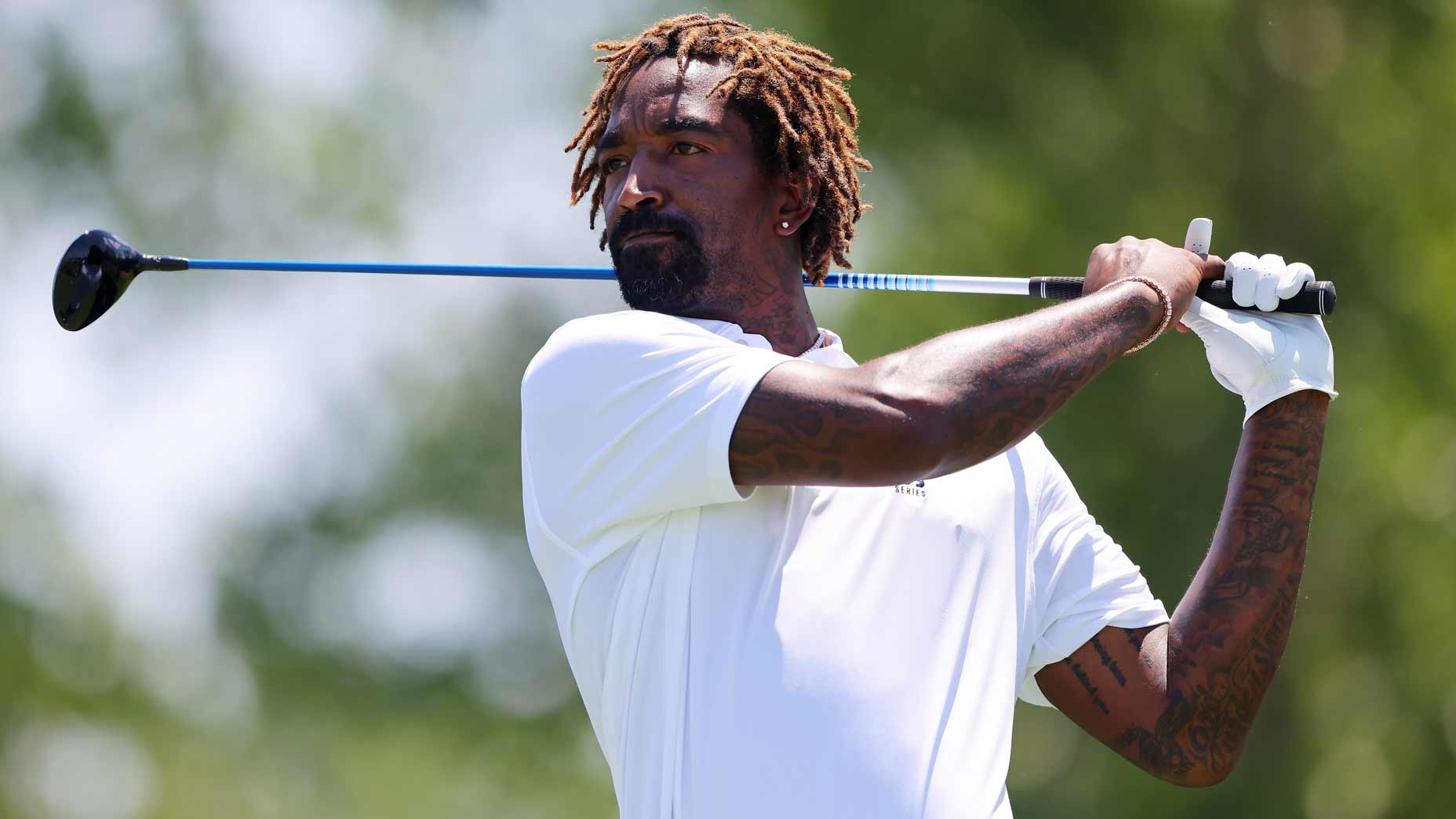 JR Smith tees off at Liberty National Golf Club in Jersey City, NJ.