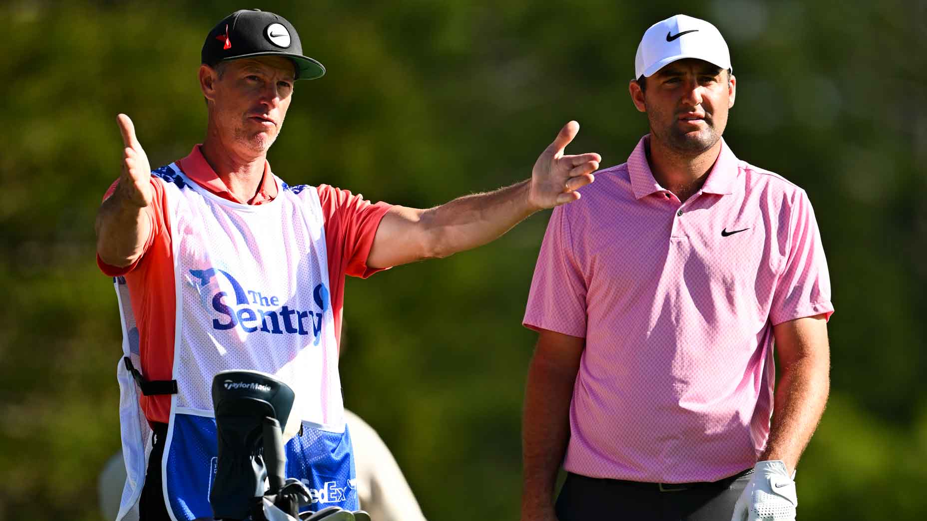 Scottie Scheffler and caddie Ted Scott on the second tee during the third round of the 2024 Sentry.