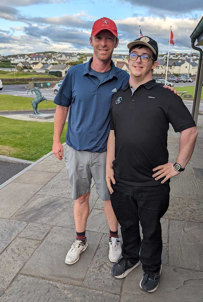 Lahinch caddie Dave O&rsquo;Brien and Jamie pose for a photo.