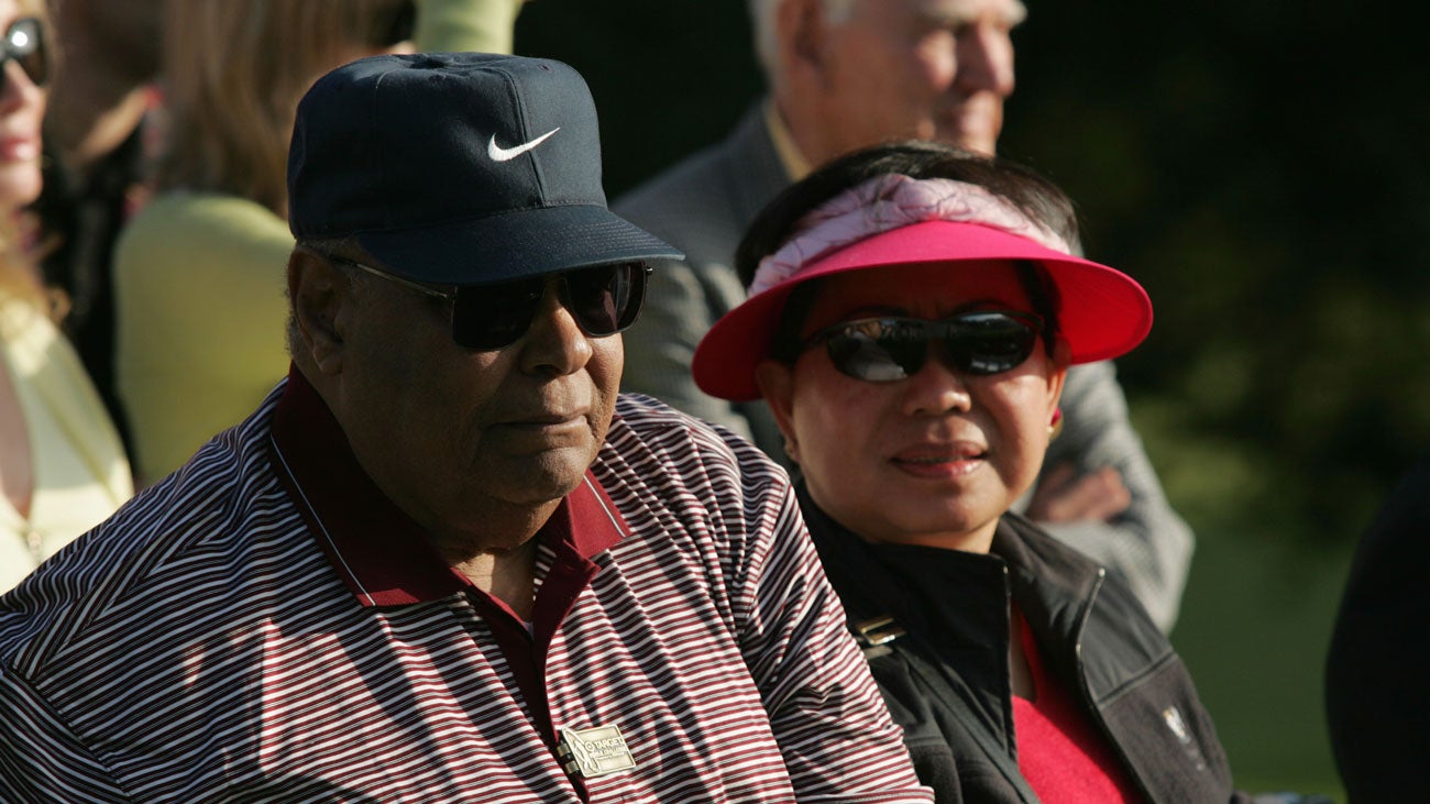 Tiger Woods' parents Earl Woods and Tida Woods sit together to watch the trophy presentation after the final round of the Target World Challenge